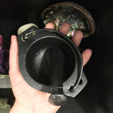 6Witch3 Cast Iron Cauldron with Pestle -  Shown held in the palm of a hand.