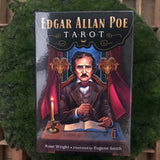 6Witch3 Edgar Allan Poe Tarot - the front of the box shown on a circle of green moss resting on a wood background