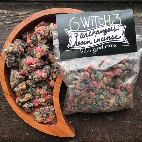 6Witch3 7 Archangels Resin incense - a 4 oz bag shown next to a moon-shaped wooden bowl containing multicolored resin incense