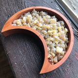 6Witch3 Frankincense Resin Incense, a moon-shaped wooden bowl of resin