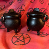 6Witch3 Mini Cast Iron Painted Cauldron - two slightly different cauldrons stand side by side on a red background with randomized pentacles